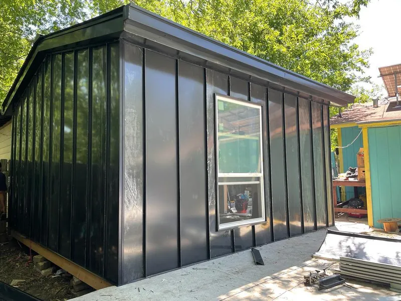 Black standing seam metal wall panels for Roof Inspection in St. Charles