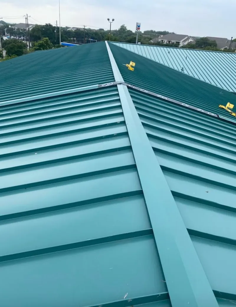 Green commercial metal roof ridge and valley for Metal Roof Repair in St. Charles